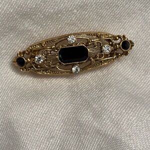 Elegant Gold & Black Brooch
